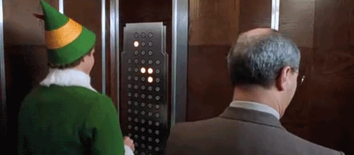 Elf-Presses-Buttons-on-Elevator.gif