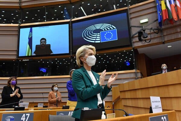 Ursula von der Leyen, who leads the E.U. executive arm, applauded President Volodymyr Zelensky of Ukraine during a video conference at the European Parliament in Brussels on Tuesday.