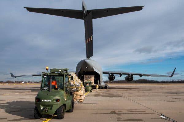 Lithuanian forces loading Stinger anti-aircraft systems and body armor bound for Ukraine, in a photograph provided by Lithuania’s defense ministry.